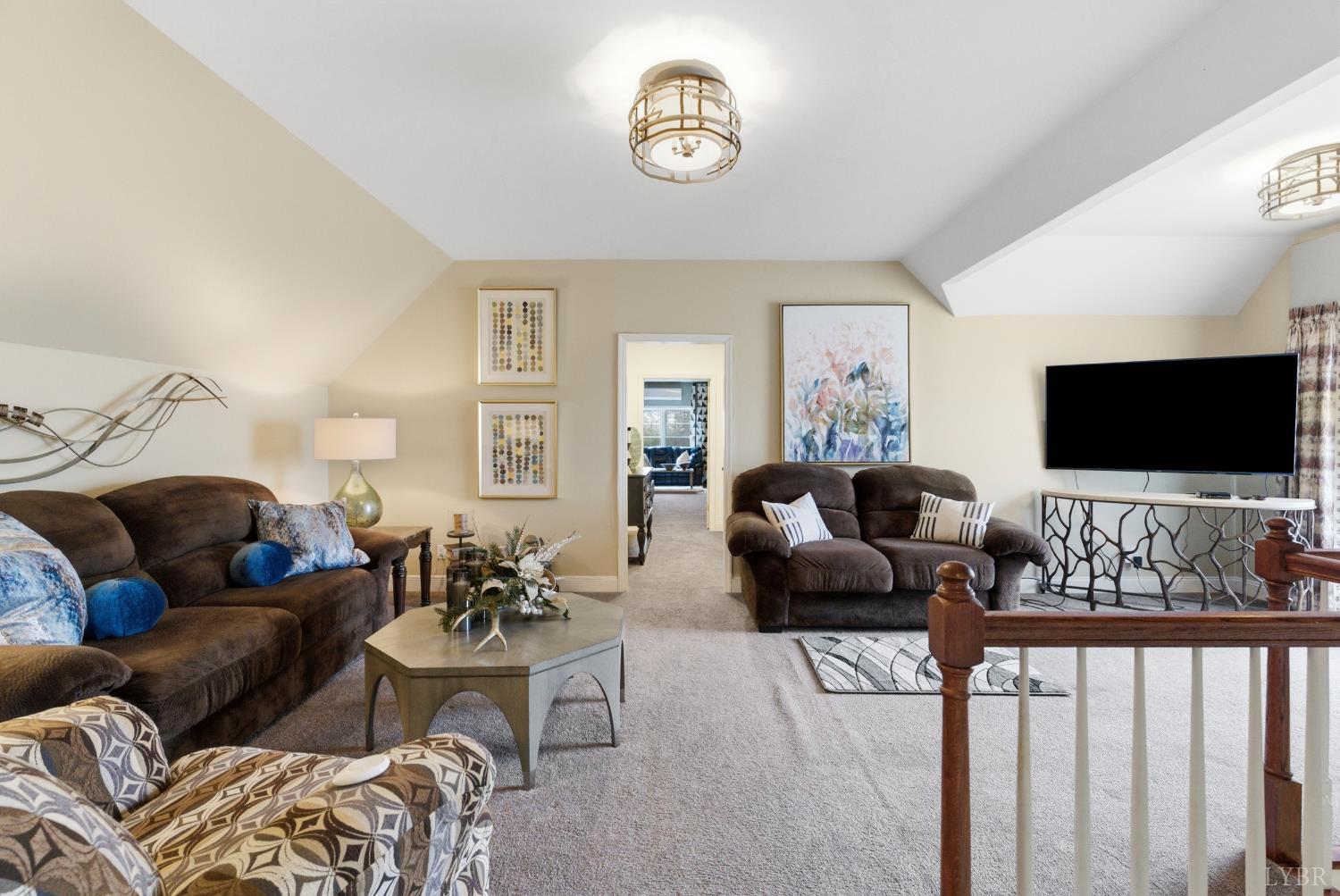 2067 Flint Hill Road Moneta, VA 24121 - Photo 37 of 70 a living room with furniture and a flat screen tv