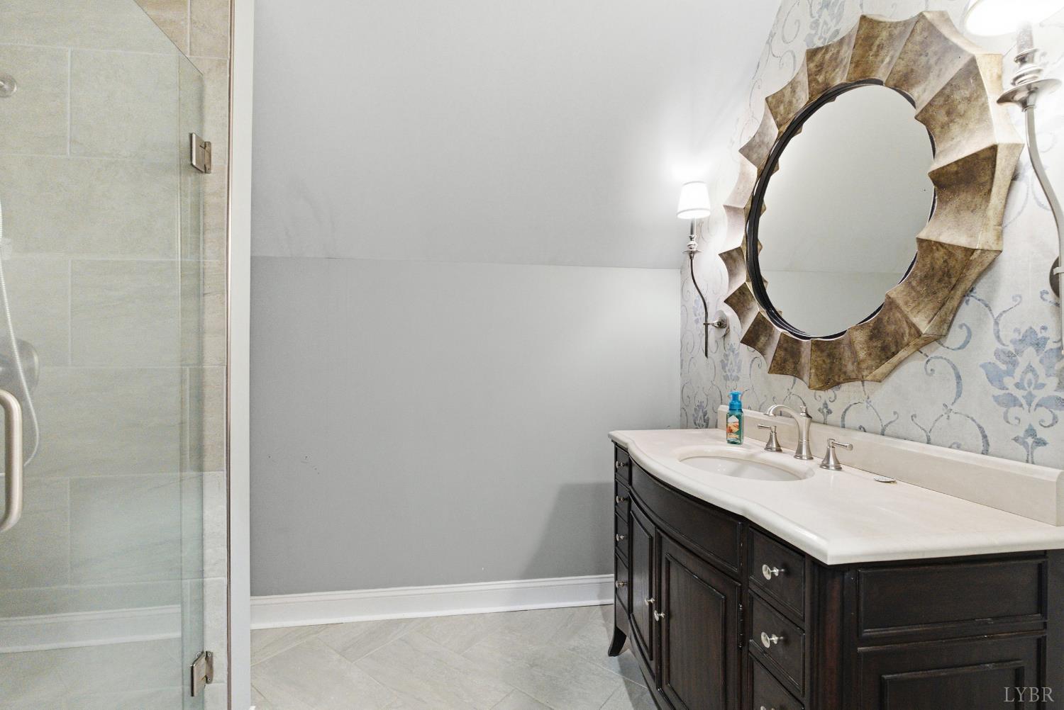 2067 Flint Hill Road Moneta, VA 24121 - Photo 38 of 70 a bathroom with a sink and a mirror