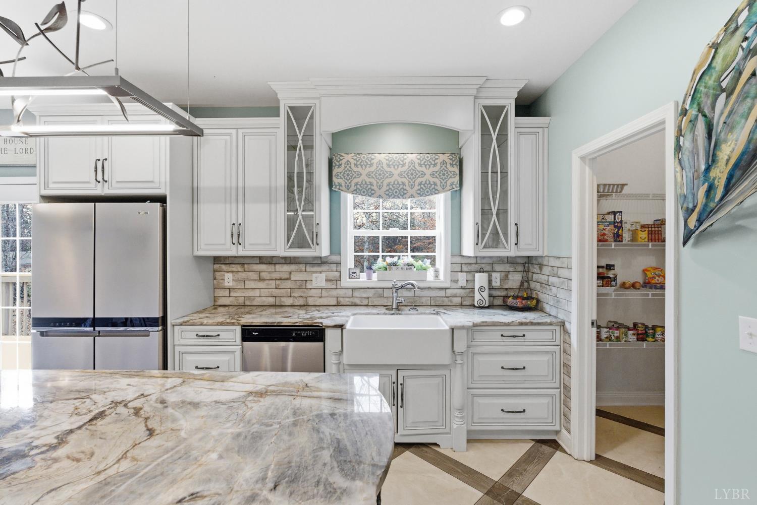 2067 Flint Hill Road Moneta, VA 24121 - Photo 39 of 70 a kitchen with granite countertop a sink stainless steel appliances and cabinets