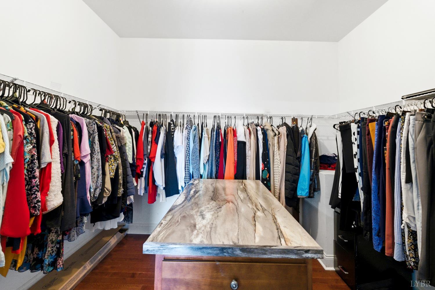 2067 Flint Hill Road Moneta, VA 24121 - Photo 40 of 70 a view of walk in closet with clothes and shoes