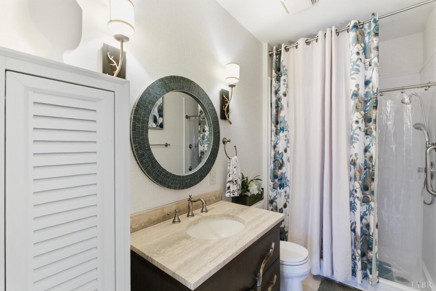 2067 Flint Hill Road Moneta, VA 24121 - Photo 46 of 70 a bathroom with a sink toilet and shower