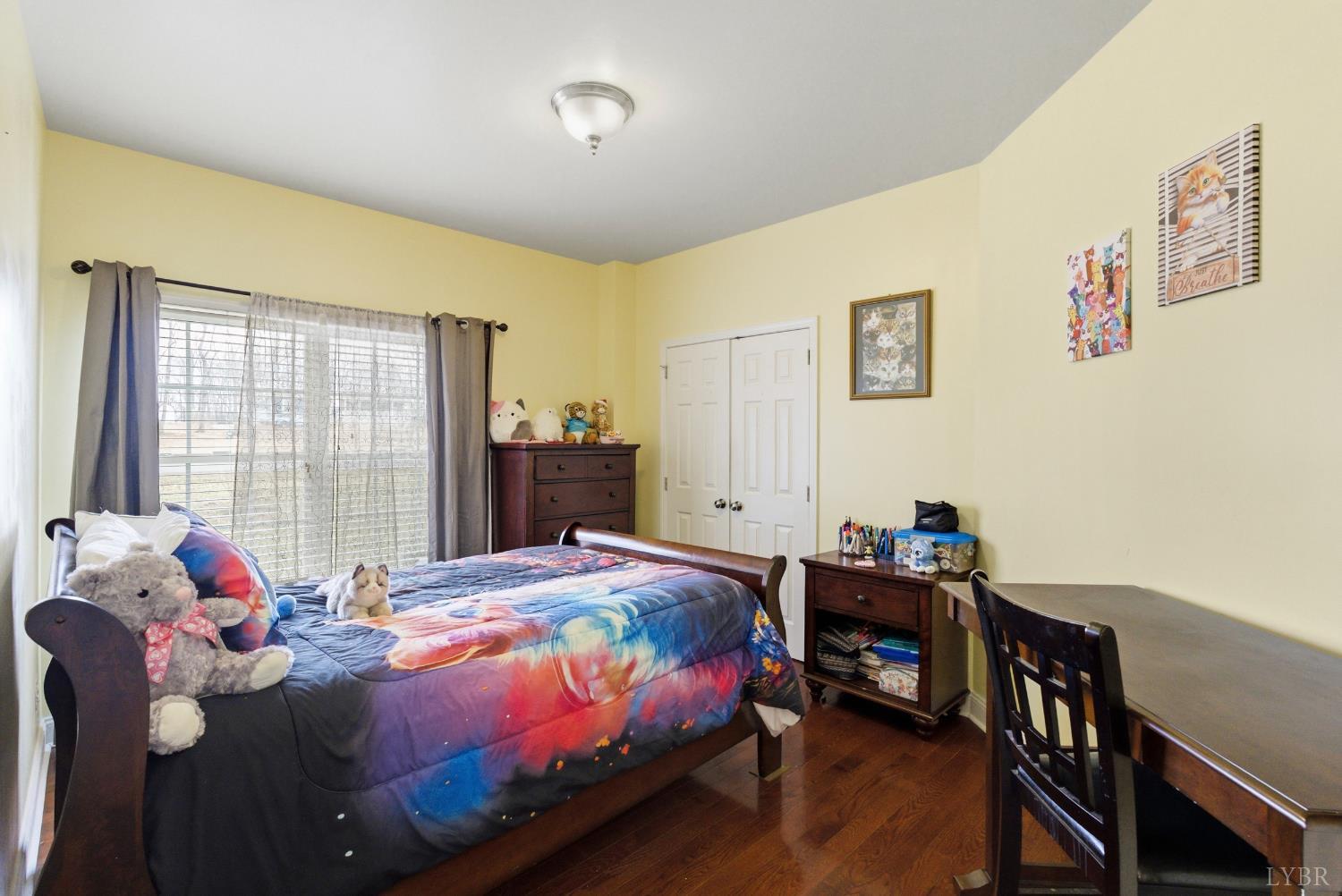 2067 Flint Hill Road Moneta, VA 24121 - Photo 47 of 70 a bedroom with a bed and wooden floor