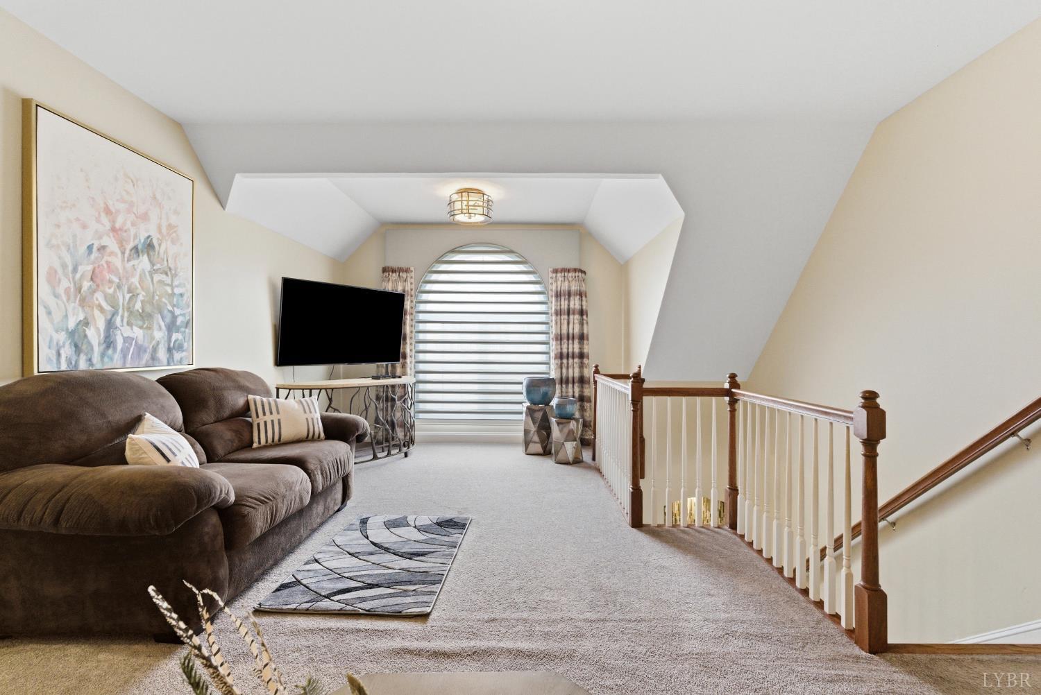2067 Flint Hill Road Moneta, VA 24121 - Photo 49 of 70 a living room with furniture and a flat screen tv