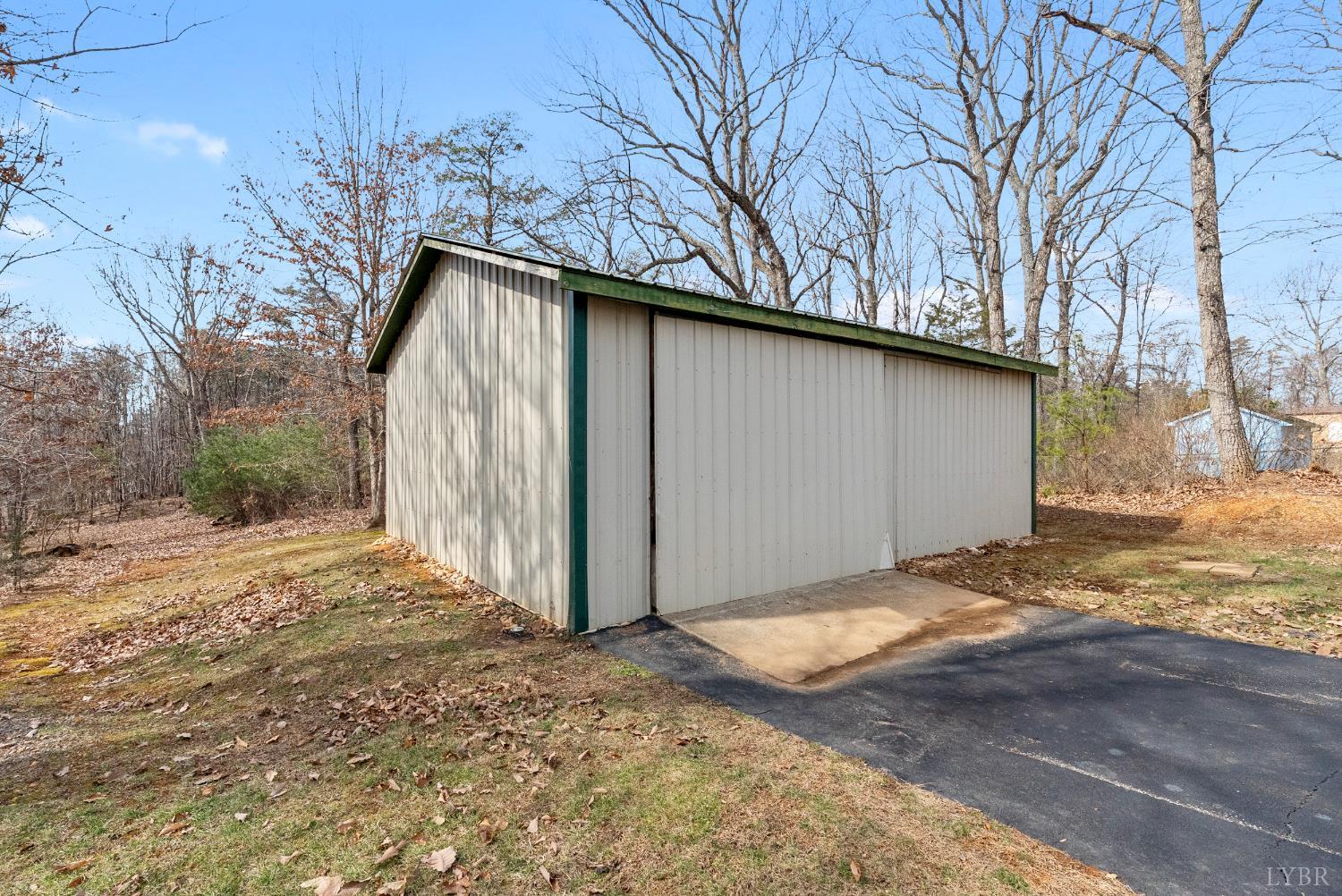 2067 Flint Hill Road Moneta, VA 24121 - Photo 60 of 70 a backyard of a house with large trees
