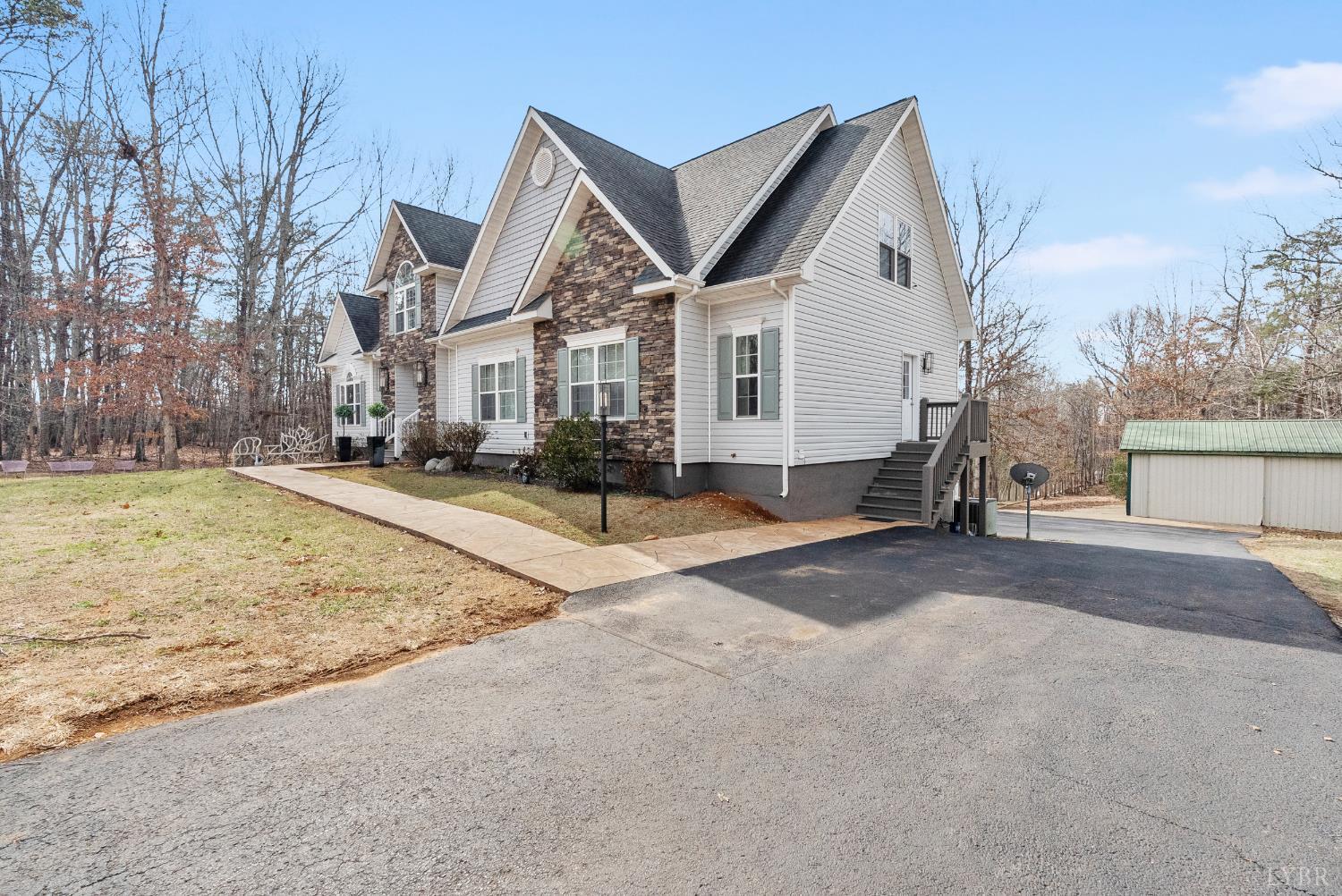 2067 Flint Hill Road Moneta, VA 24121 - Photo 66 of 70 a front view of a house with a yard and garage