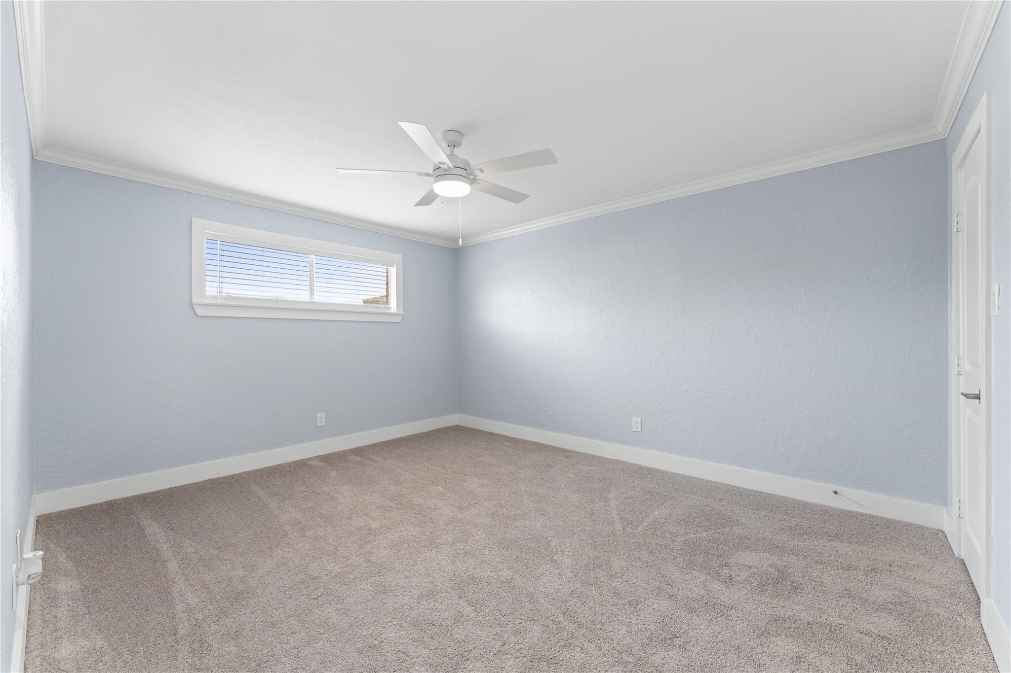8118 Albacore Drive, Unit 7 Houston, TX 77074 - Photo 13 of 18 a view of an empty room with a window