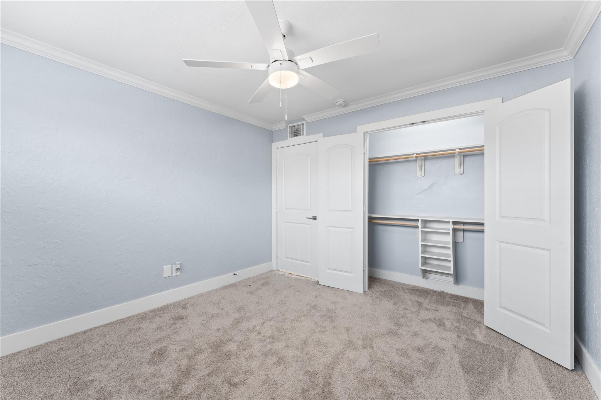 8118 Albacore Drive, Unit 7 Houston, TX 77074 - Photo 14 of 18 an empty room with a ceiling fan and entryway