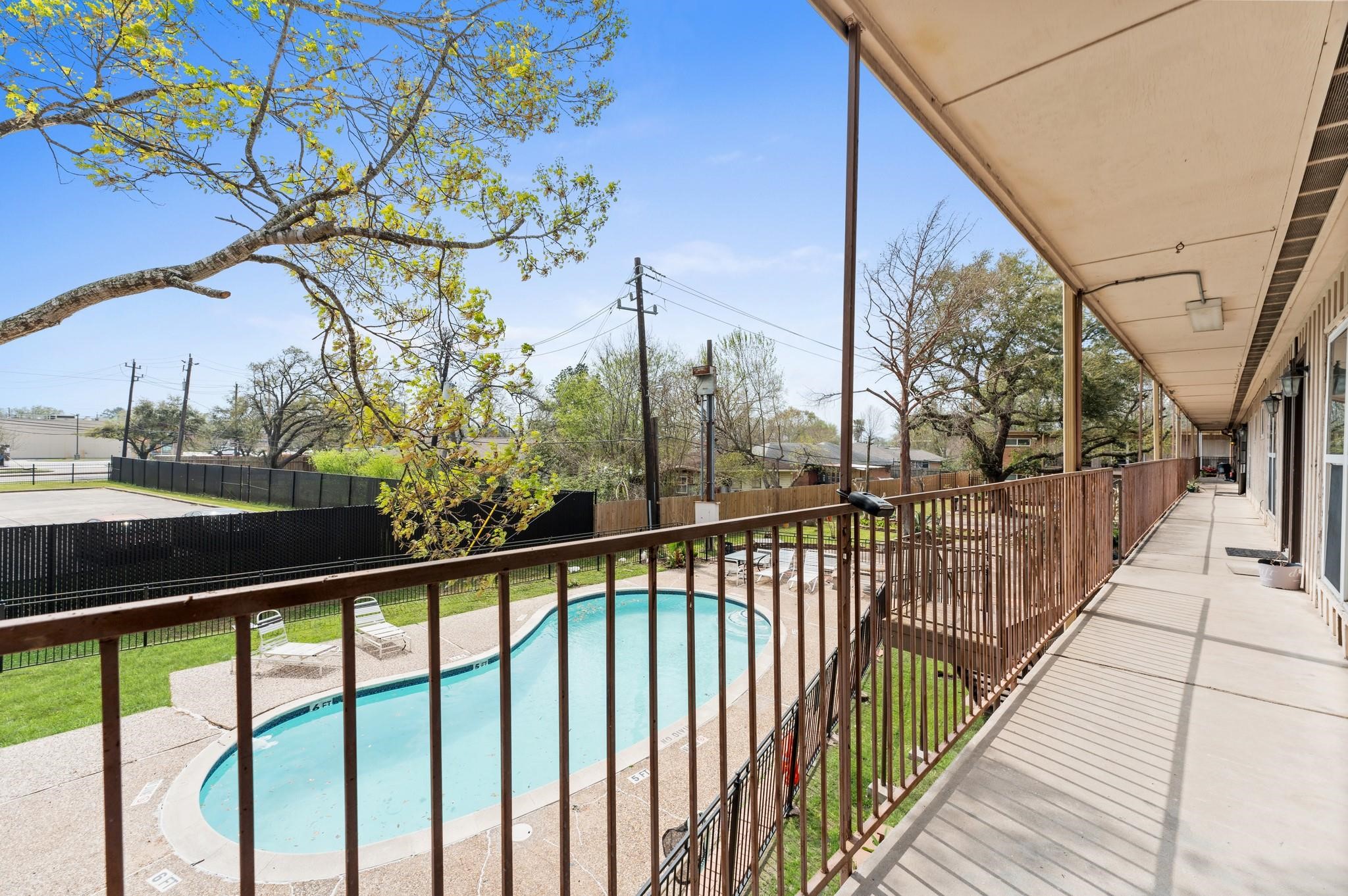 8118 Albacore Drive, Unit 7 Houston, TX 77074 - Photo 16 of 18 a view of a street from a balcony