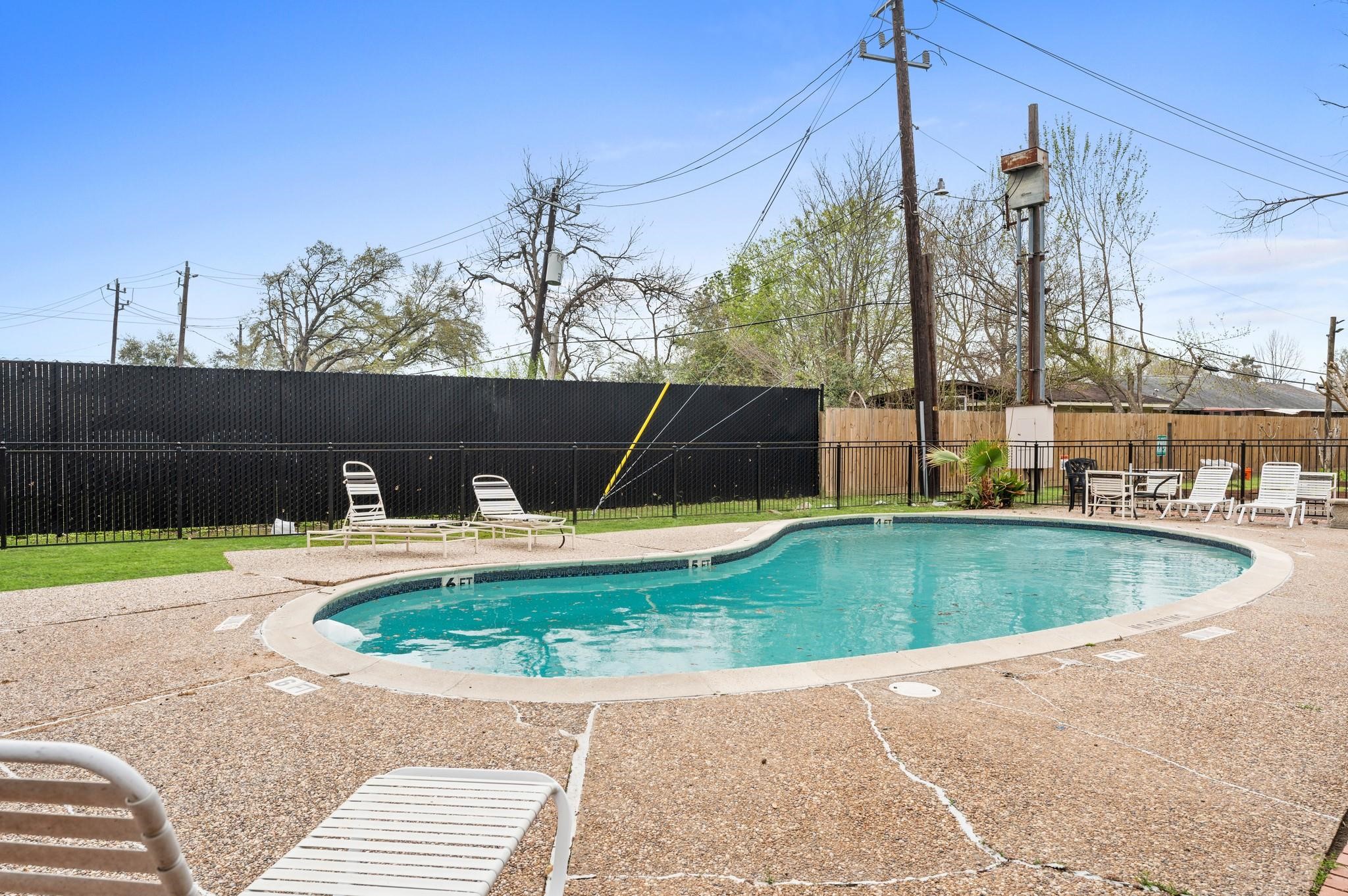 8118 Albacore Drive, Unit 7 Houston, TX 77074 - Photo 17 of 18 a view of a swimming pool with a patio