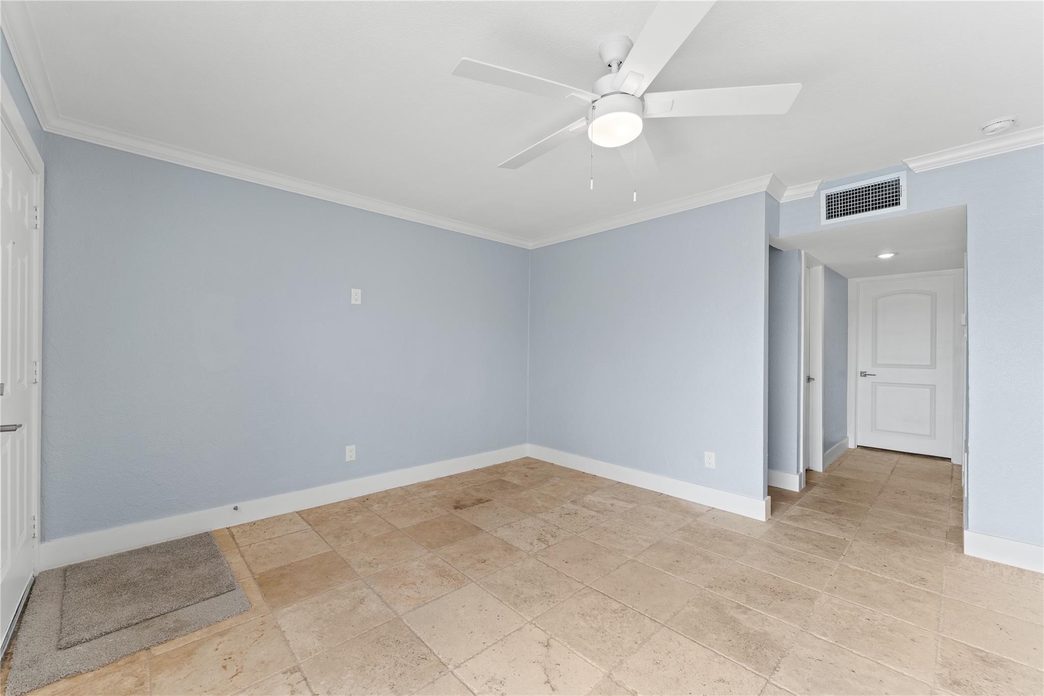 8118 Albacore Drive, Unit 7 Houston, TX 77074 - Photo 5 of 18 an empty room with a ceiling fan and a window