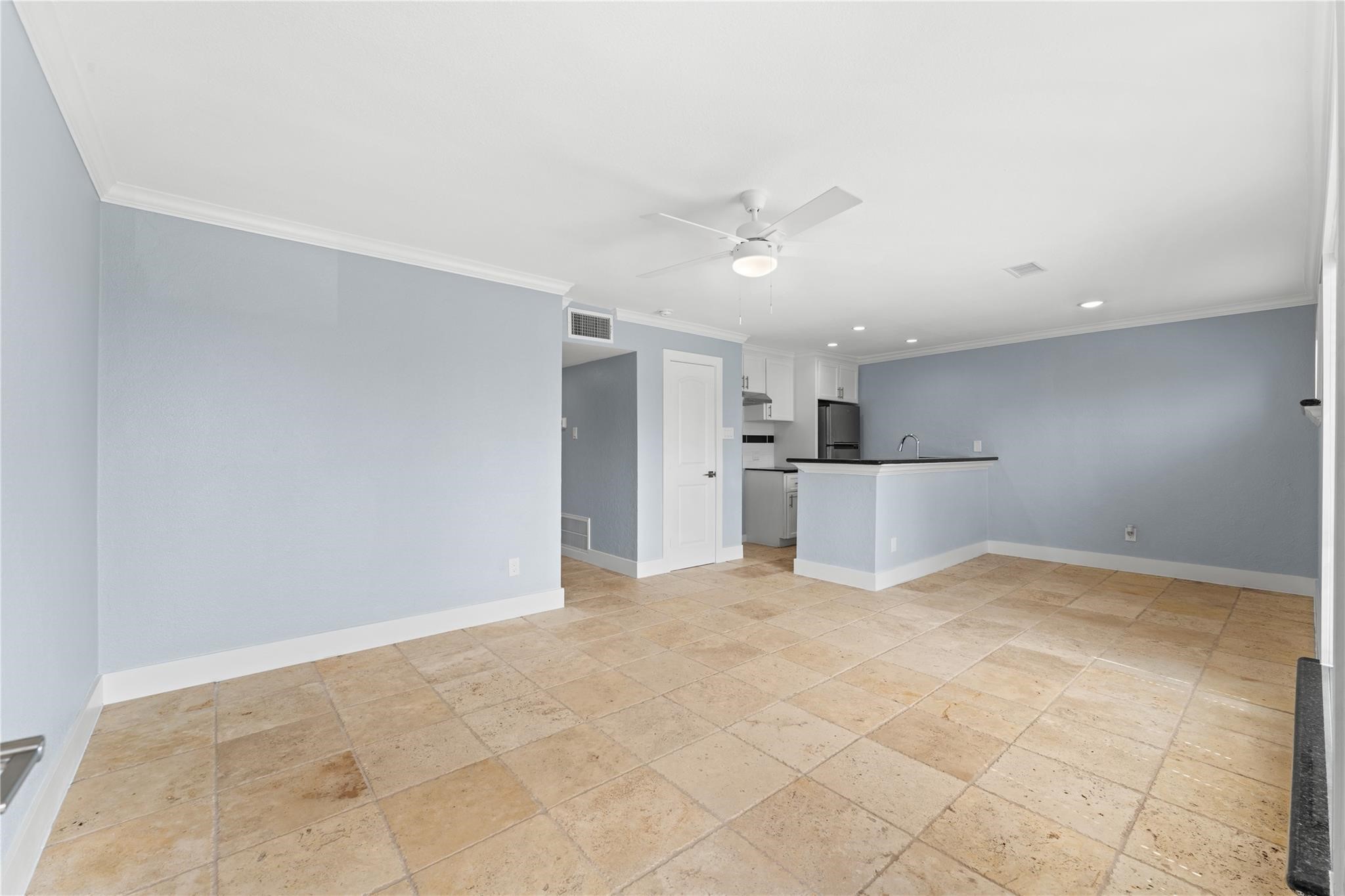 8118 Albacore Drive, Unit 7 Houston, TX 77074 - Photo 6 of 18 a view of a kitchen with a dishwasher and a refrigerator