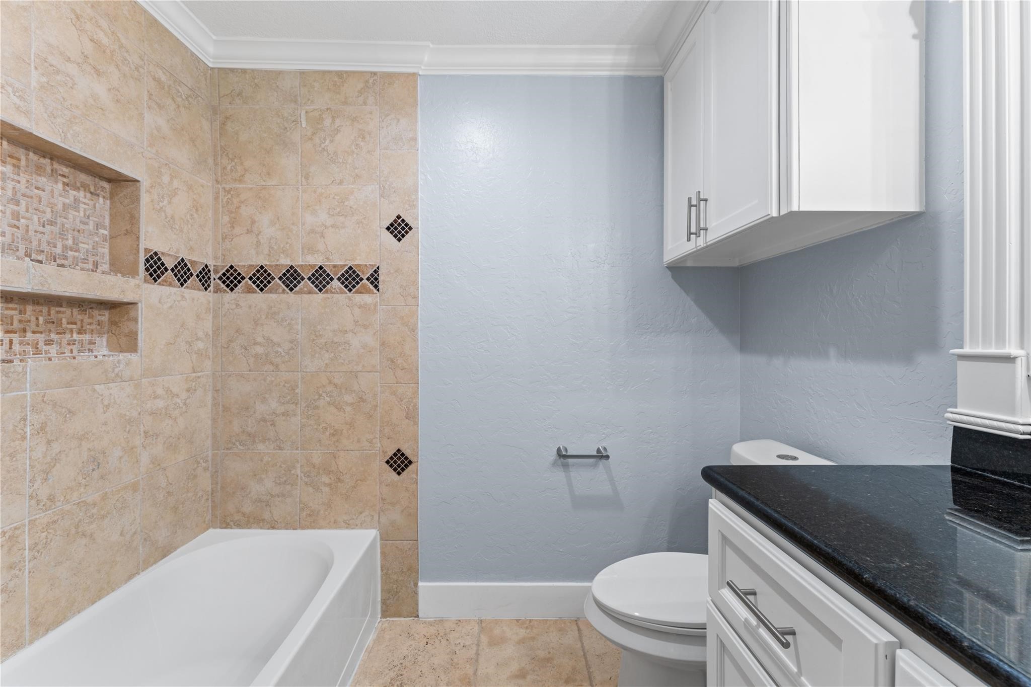 8118 Albacore Drive, Unit 7 Houston, TX 77074 - Photo 10 of 18 a bathroom with a granite countertop bathtub sink vanity mirror and toilet