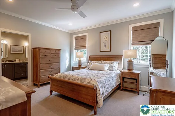 a bedroom with a bed and a television