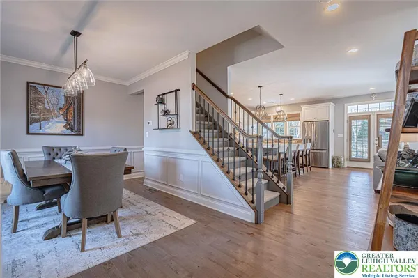 a view of a livingroom with furniture and hardwood floor