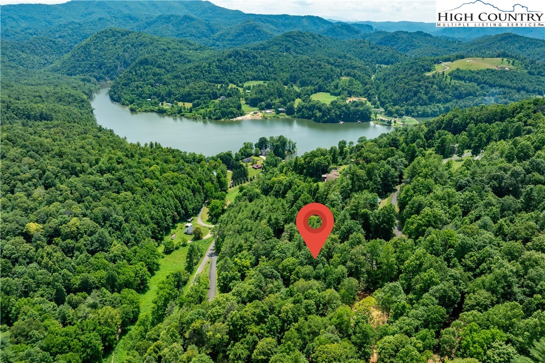 Lot 2 Lake Ridge Butler, TN 37640 - Photo 11 of 26 a view of a house with a backyard and a lake view