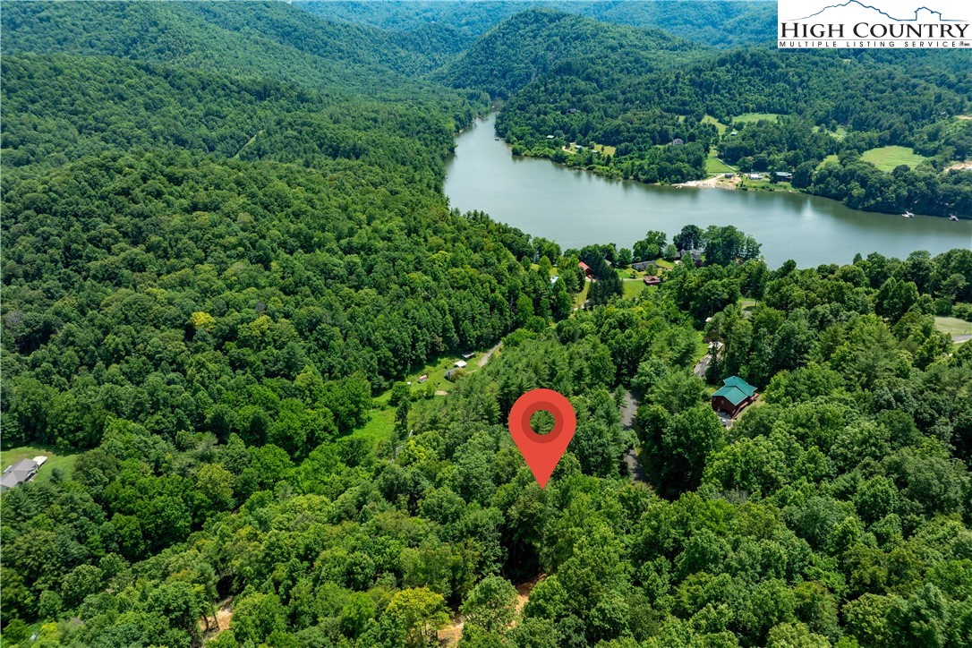 Lot 2 Lake Ridge Butler, TN 37640 - Photo 13 of 26 a view of a house with a backyard and a forest