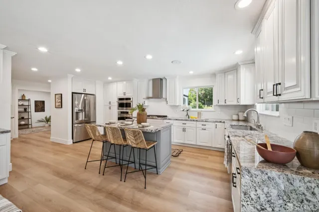 a kitchen with a sink cabinets and window