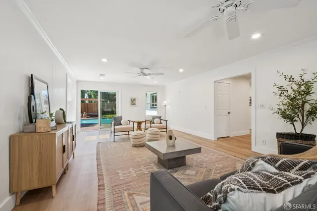 a living room with furniture and a table