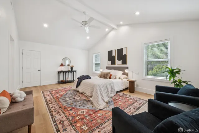 a bedroom with bed and a couch