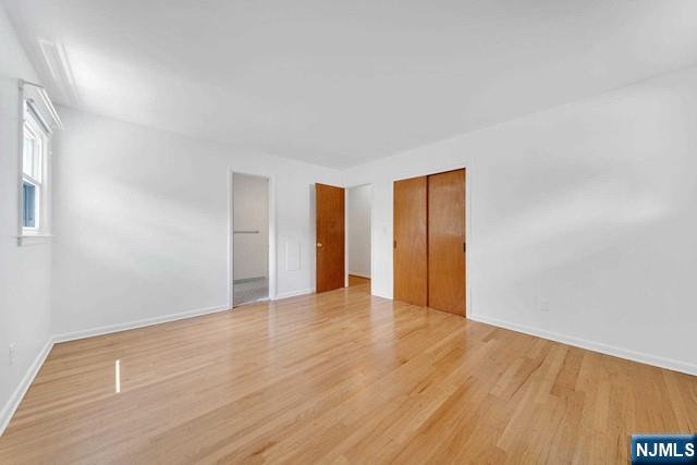 516 Knickerbocker Road Cresskill, NJ 07626 - Photo 17 of 31 a view of an empty room with wooden floor and a window