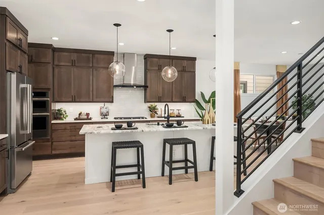 a kitchen with a sink cabinets and stainless steel appliances