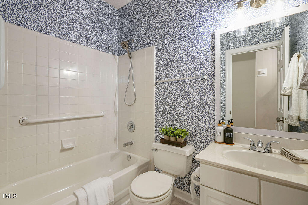 125 Chimney Rise Drive Cary, NC 27511 - Photo 30 of 41 a bathroom with a sink toilet and shower