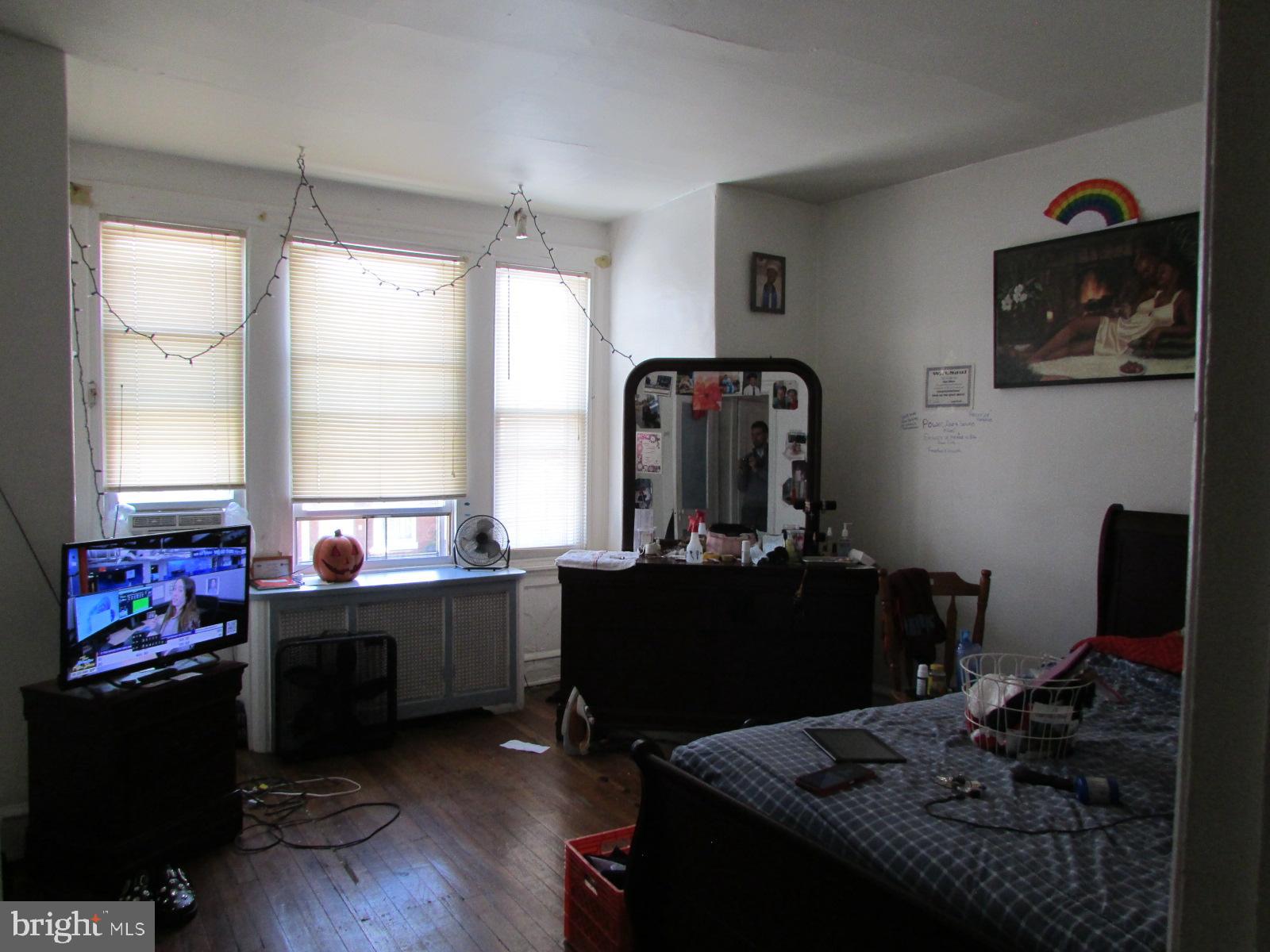 524 West Tabor Road Philadelphia, PA 19120 - Photo 12 of 14 a living room with furniture and a fireplace