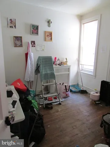 a room with furniture and a wooden floor