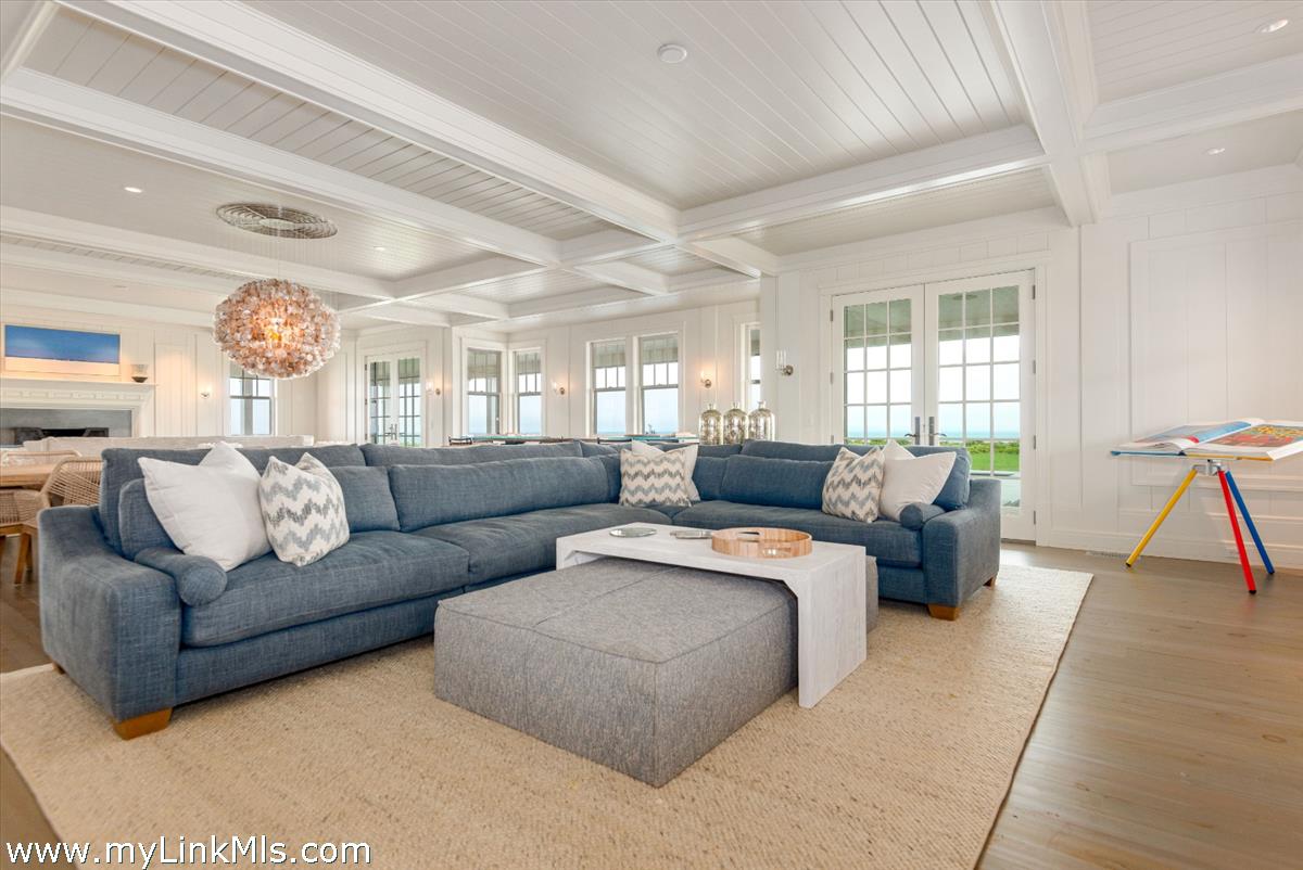37 Sankaty Head Road Nantucket, MA 02554 - Photo 20 of 65 a living room with furniture and a large window
