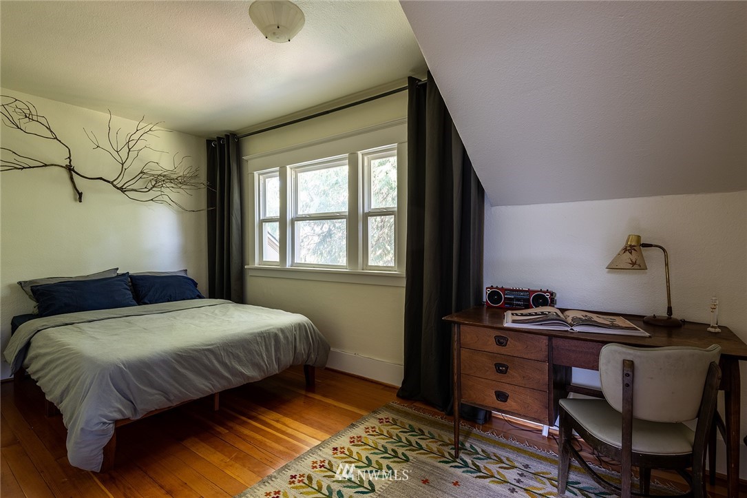 9048 Southwest Soper Road Vashon, WA 98070 - Photo 12 of 27 a bedroom with a bed and a window