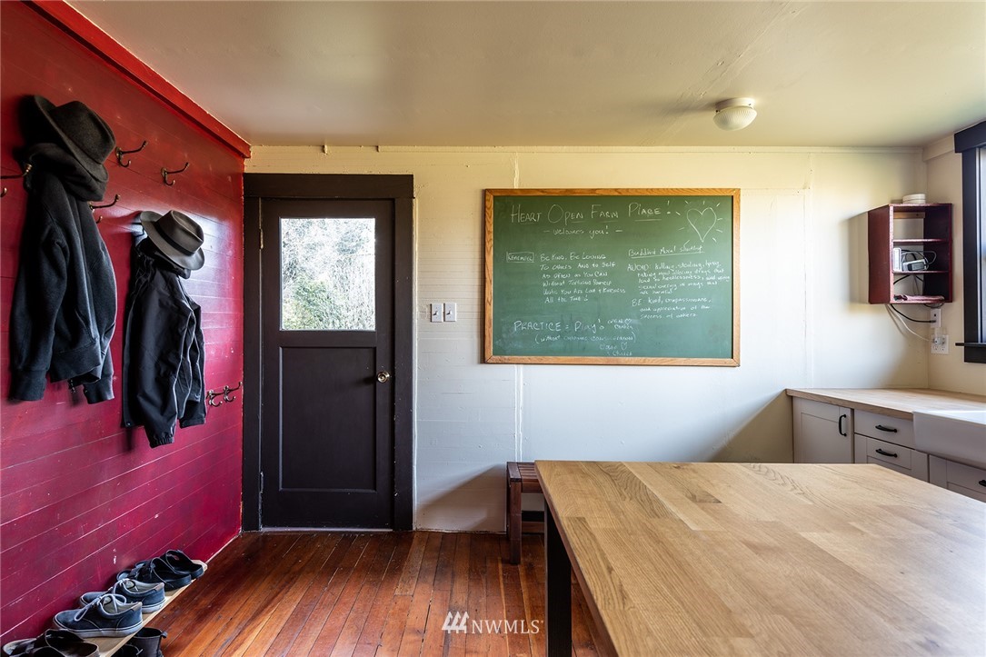9048 Southwest Soper Road Vashon, WA 98070 - Photo 13 of 27 a bed room with a bed and a window