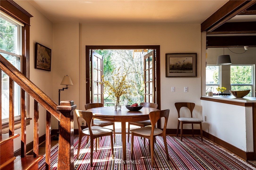 9048 Southwest Soper Road Vashon, WA 98070 - Photo 3 of 27 a view of a dining room with furniture window and wooden floor
