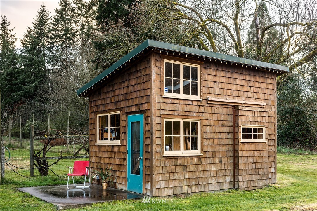 9048 Southwest Soper Road Vashon, WA 98070 - Photo 21 of 27 a backyard of a house with barbeque oven
