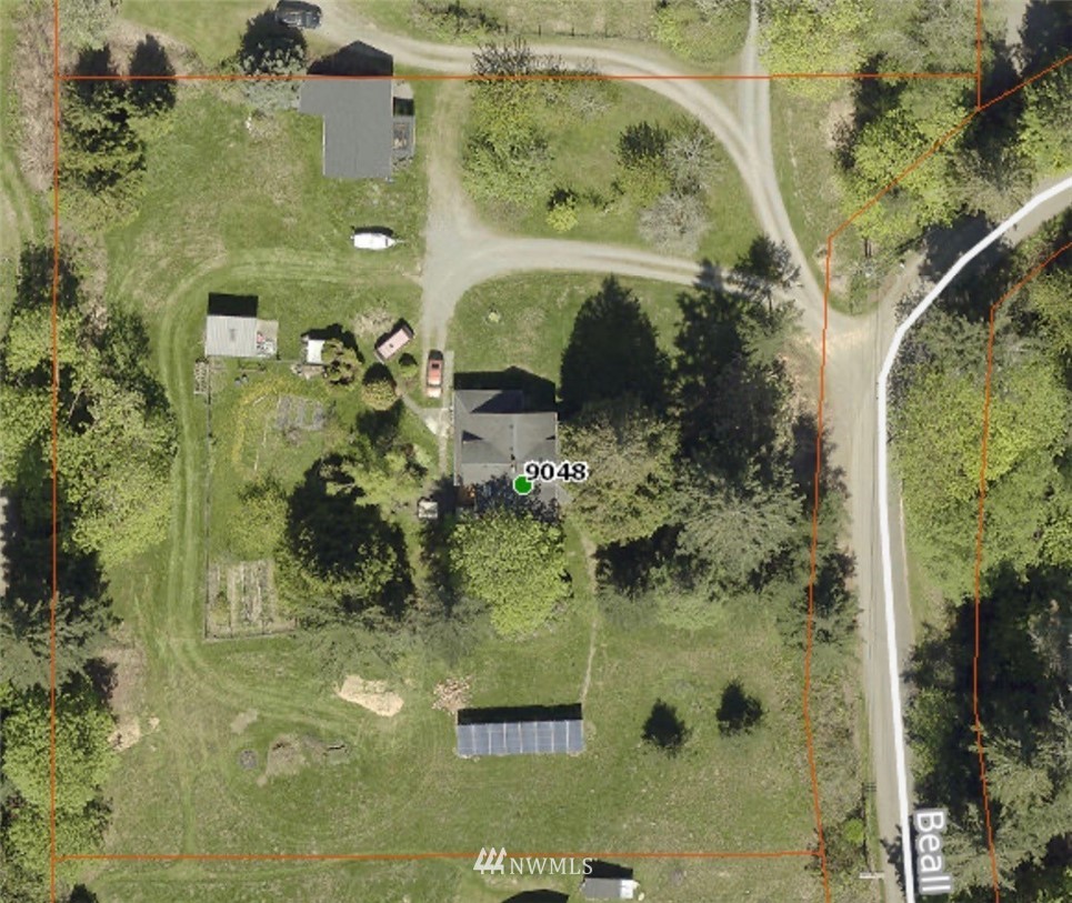 9048 Southwest Soper Road Vashon, WA 98070 - Photo 27 of 27 a bathroom with a glass shower door