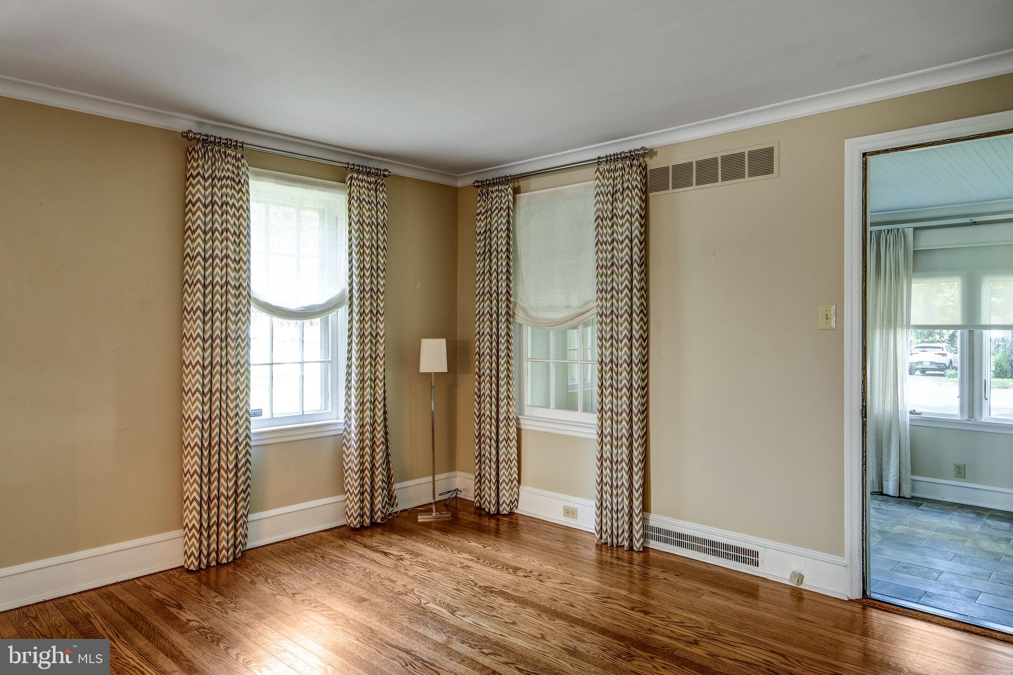 312 Woodland Avenue Haddonfield, NJ 08033 - Photo 19 of 44 an empty room with wooden floor and windows