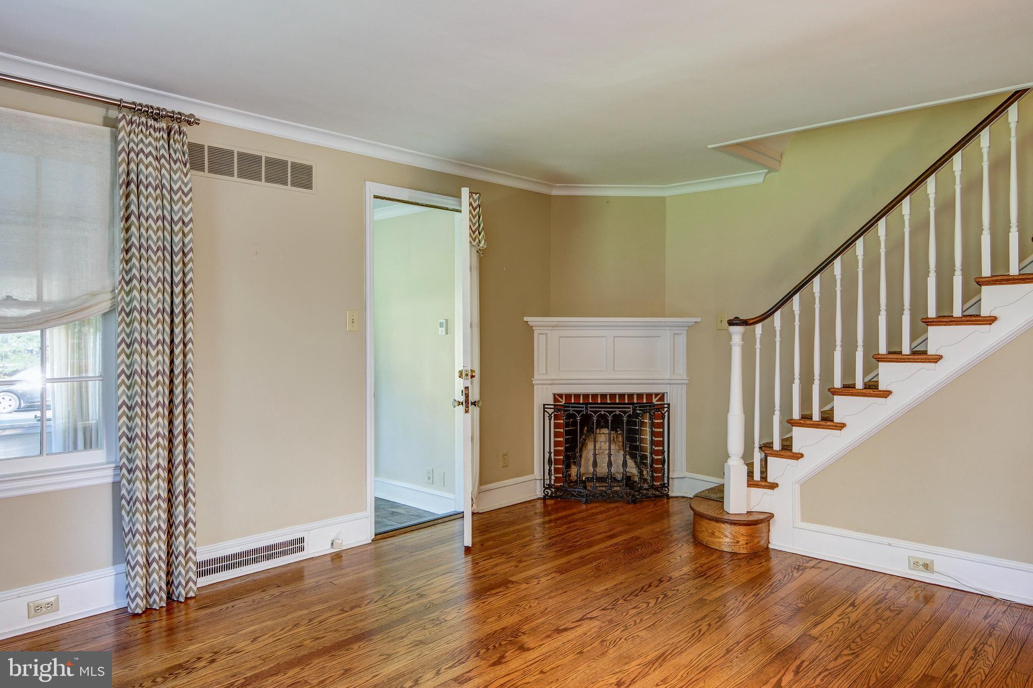 312 Woodland Avenue Haddonfield, NJ 08033 - Photo 20 of 44 a view of an empty room with wooden floor fireplace and a window