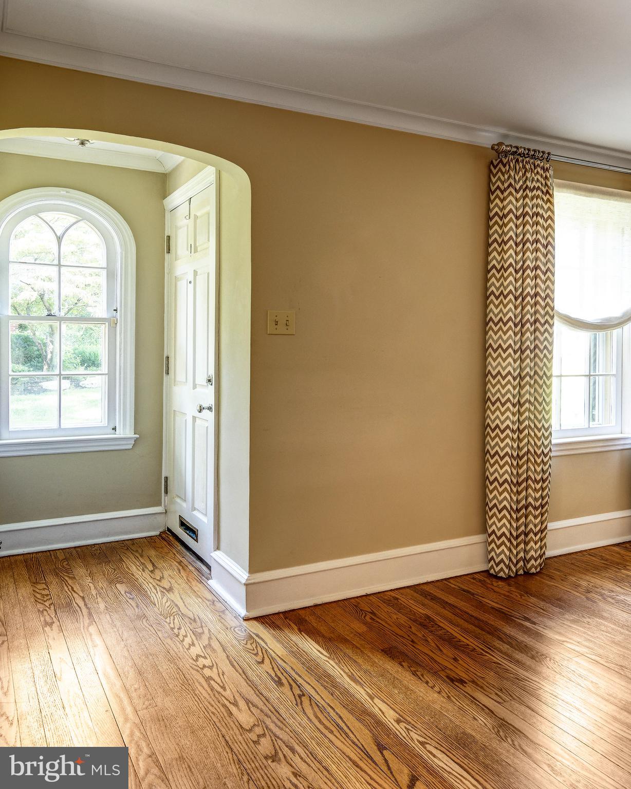 312 Woodland Avenue Haddonfield, NJ 08033 - Photo 22 of 44 an empty room with wooden floor and windows