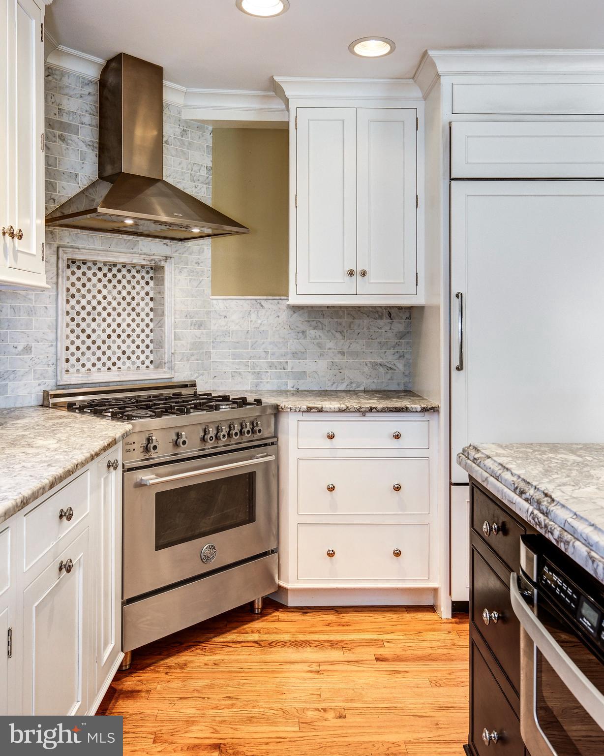 312 Woodland Avenue Haddonfield, NJ 08033 - Photo 30 of 44 a kitchen with granite countertop a stove and a sink
