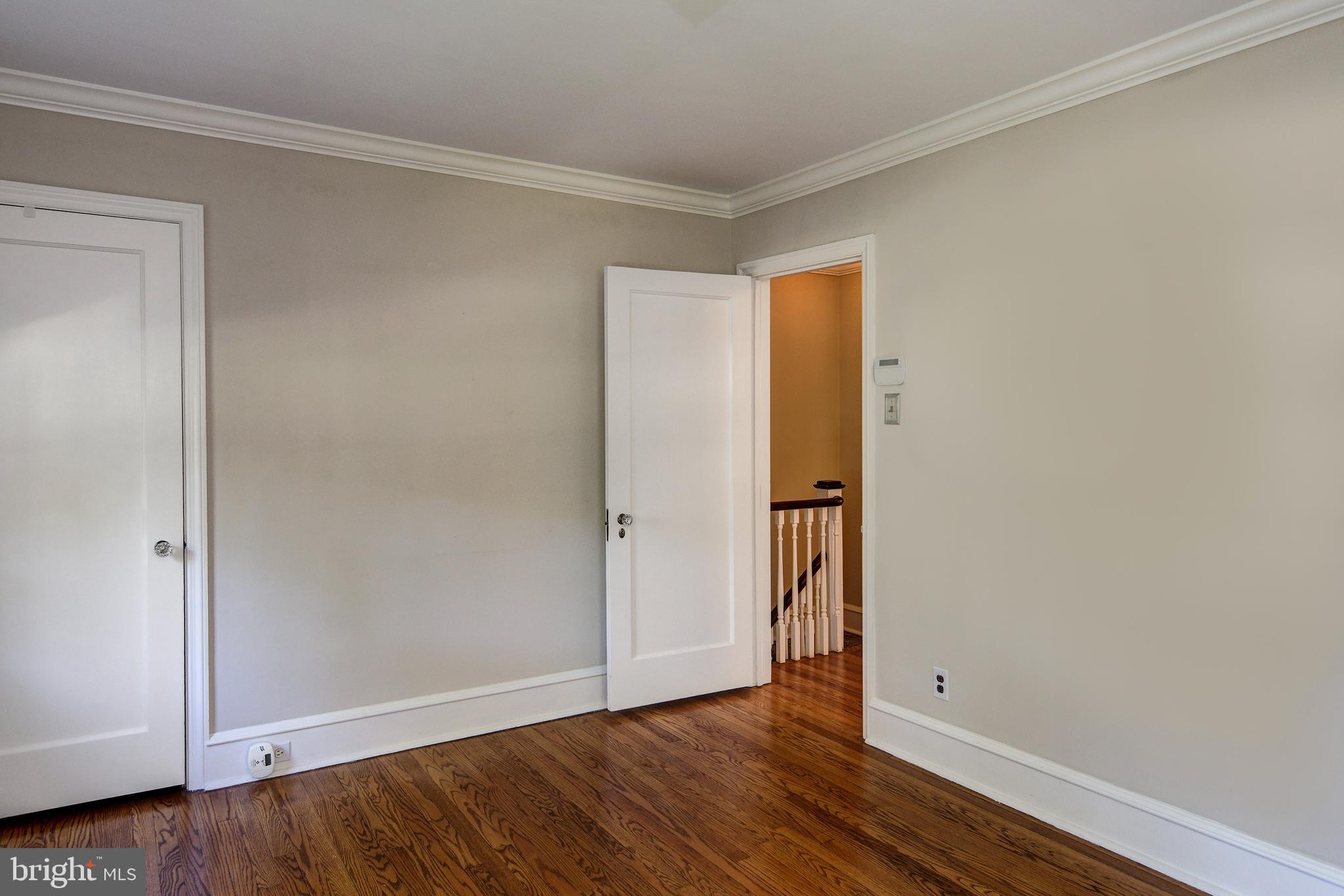 312 Woodland Avenue Haddonfield, NJ 08033 - Photo 34 of 44 a view of an empty room with wooden floor and closet