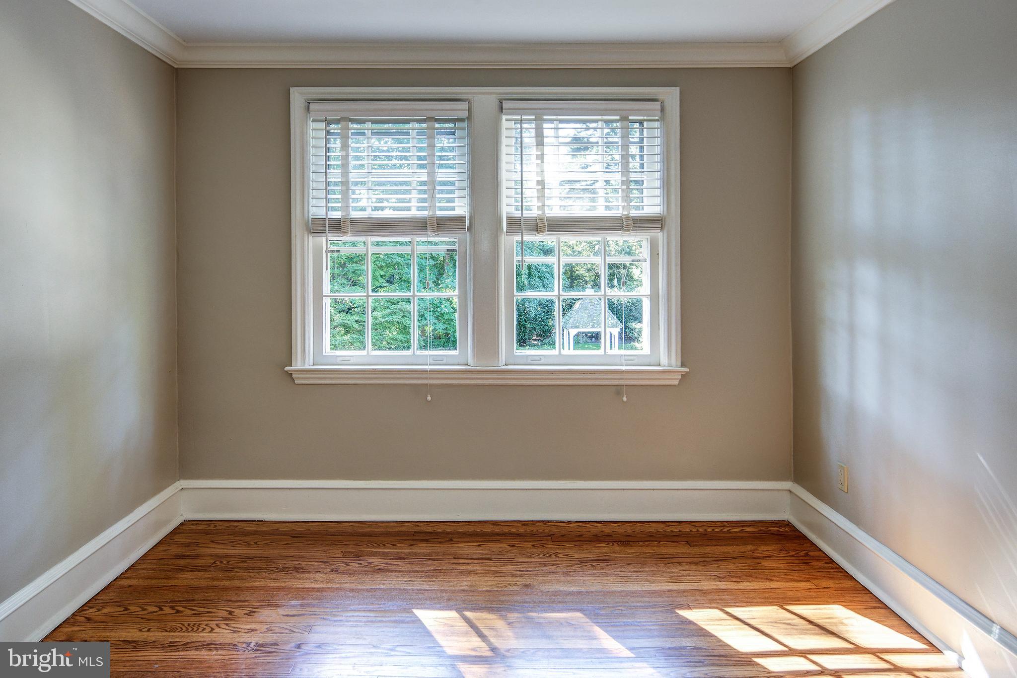312 Woodland Avenue Haddonfield, NJ 08033 - Photo 35 of 44 a view of a room with wooden floor and windows in it