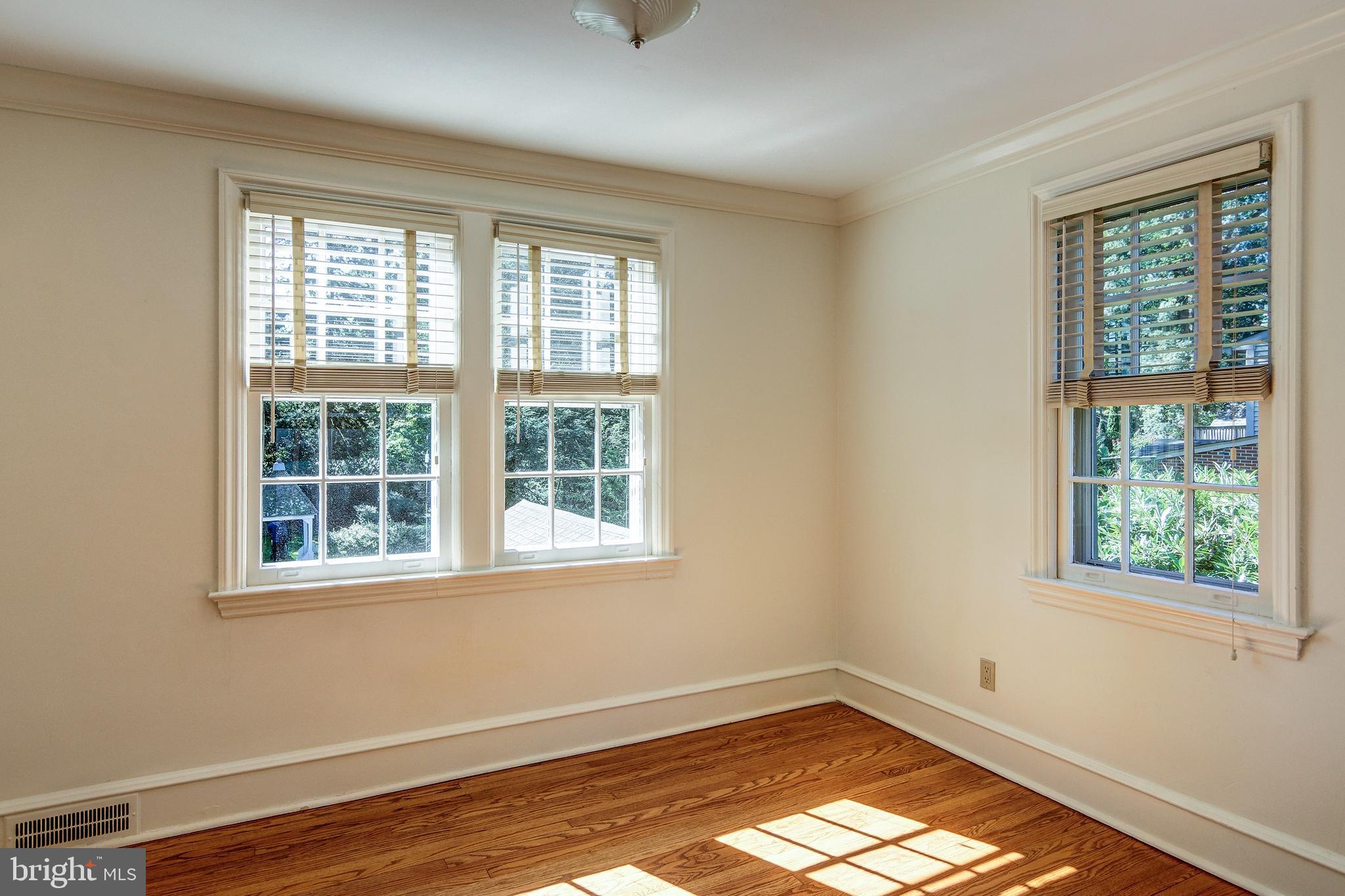 312 Woodland Avenue Haddonfield, NJ 08033 - Photo 37 of 44 a view of an empty room with wooden floor and a window