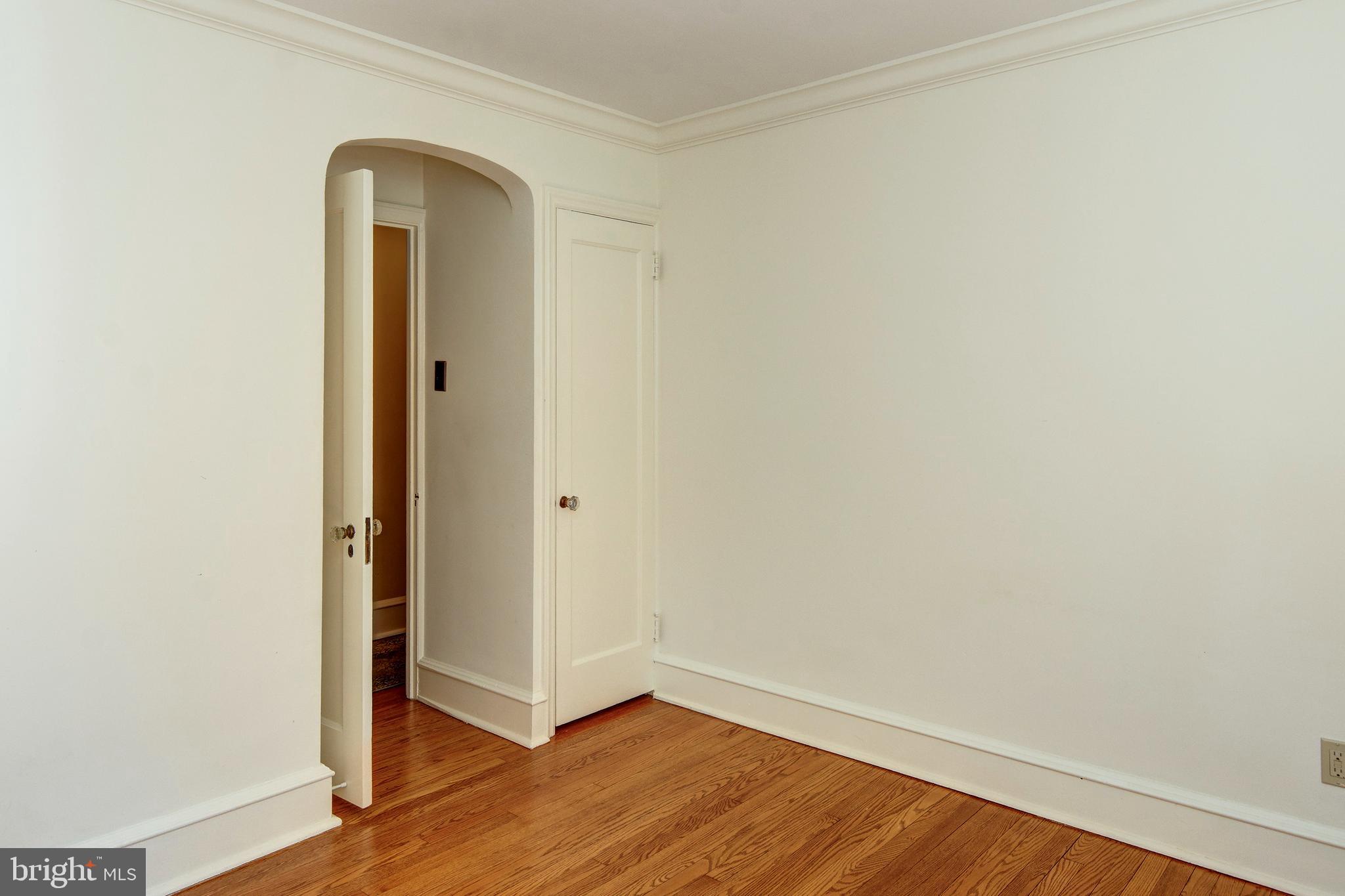312 Woodland Avenue Haddonfield, NJ 08033 - Photo 38 of 44 an empty room with wooden floor and a window