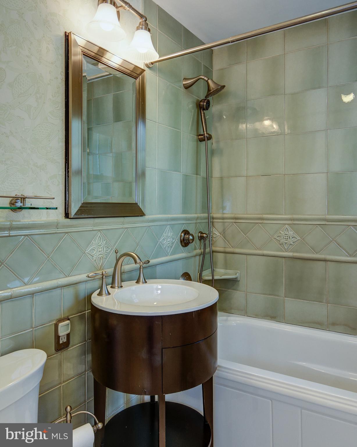 312 Woodland Avenue Haddonfield, NJ 08033 - Photo 39 of 44 a bathroom with a sink and a mirror