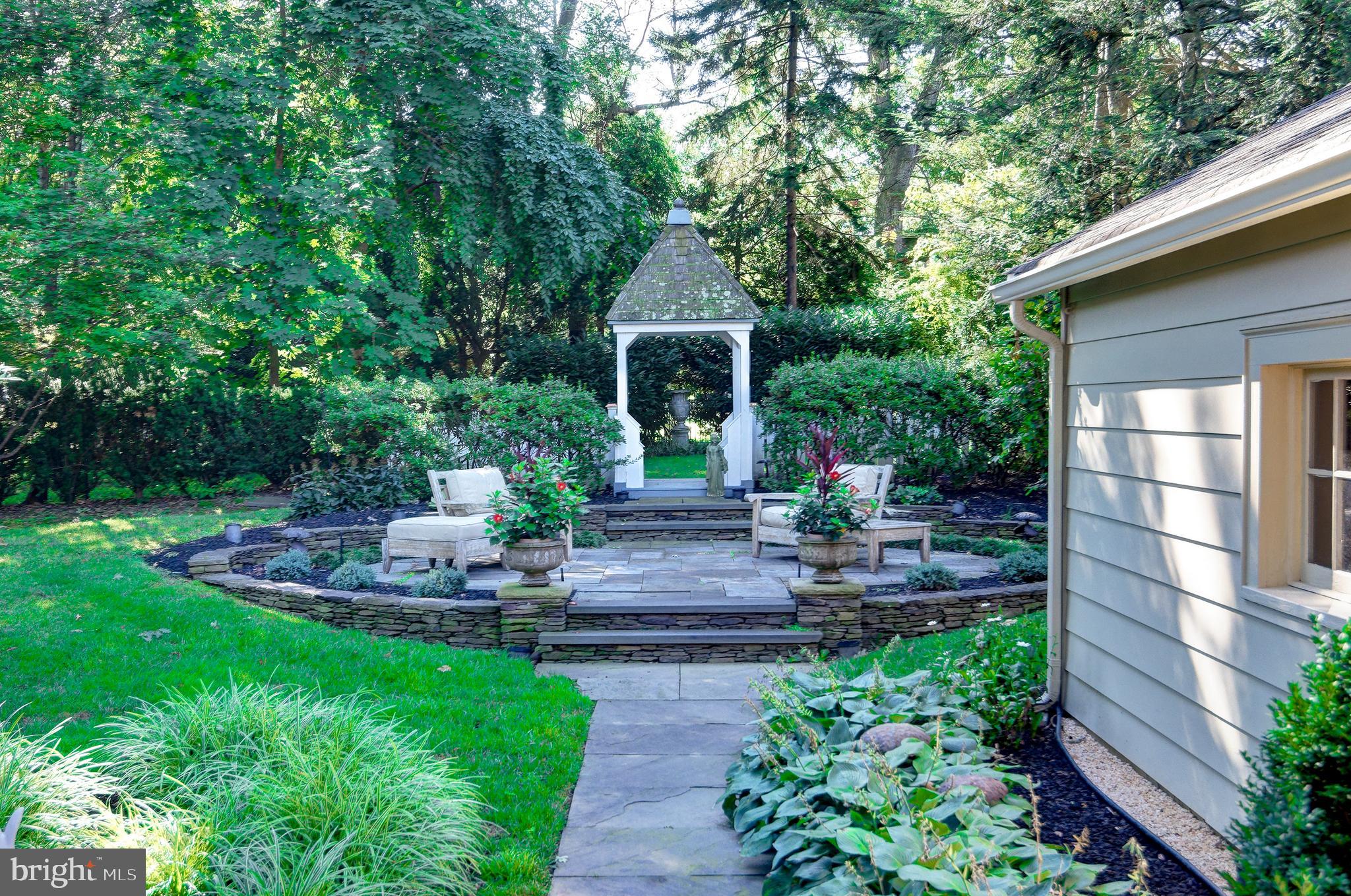 312 Woodland Avenue Haddonfield, NJ 08033 - Photo 4 of 44 a view of a house with a yard and plants