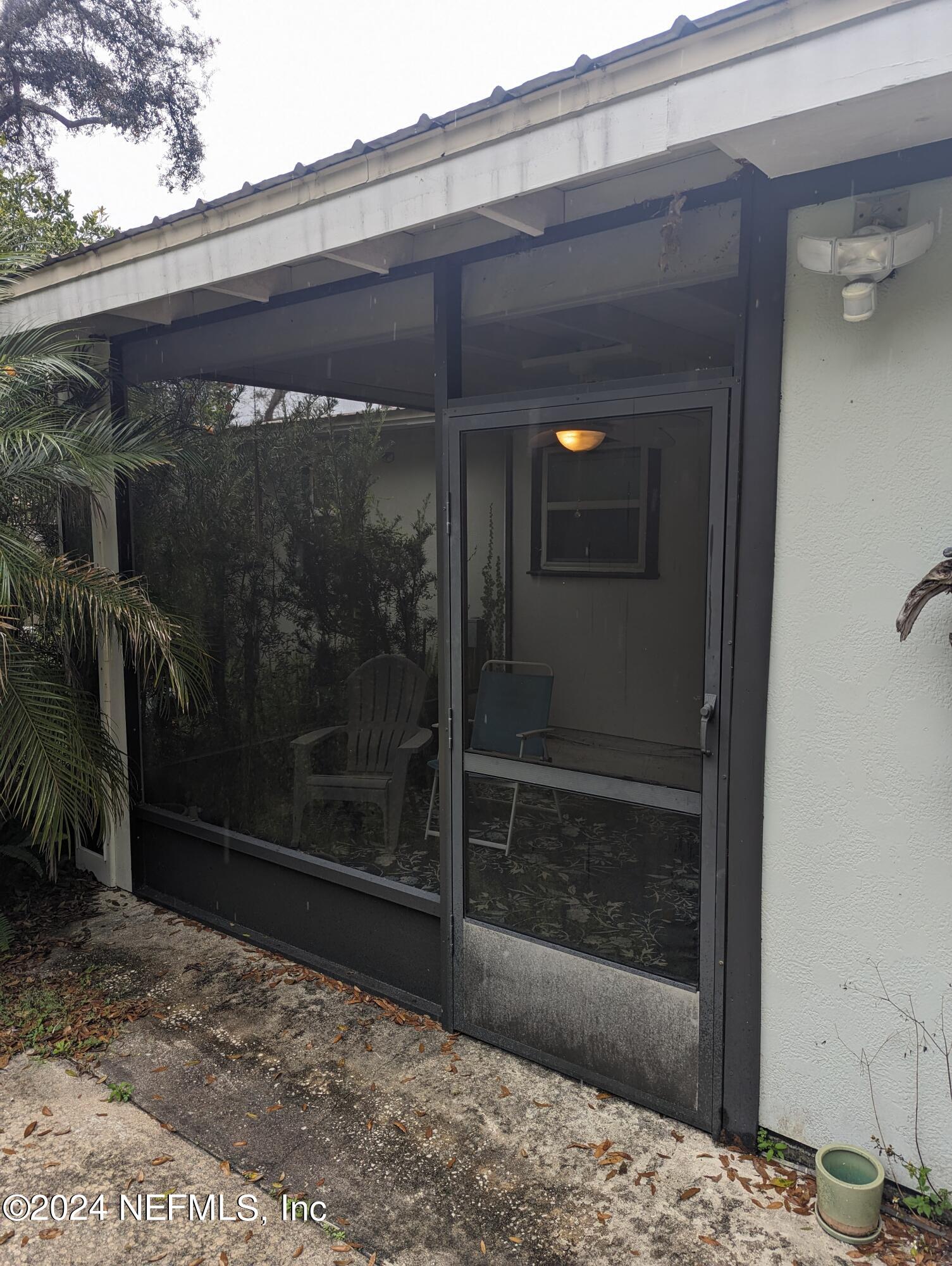 5120 Oakside Drive Jacksonville, FL 32244 - Photo 14 of 24 a view of a glass door with a shower