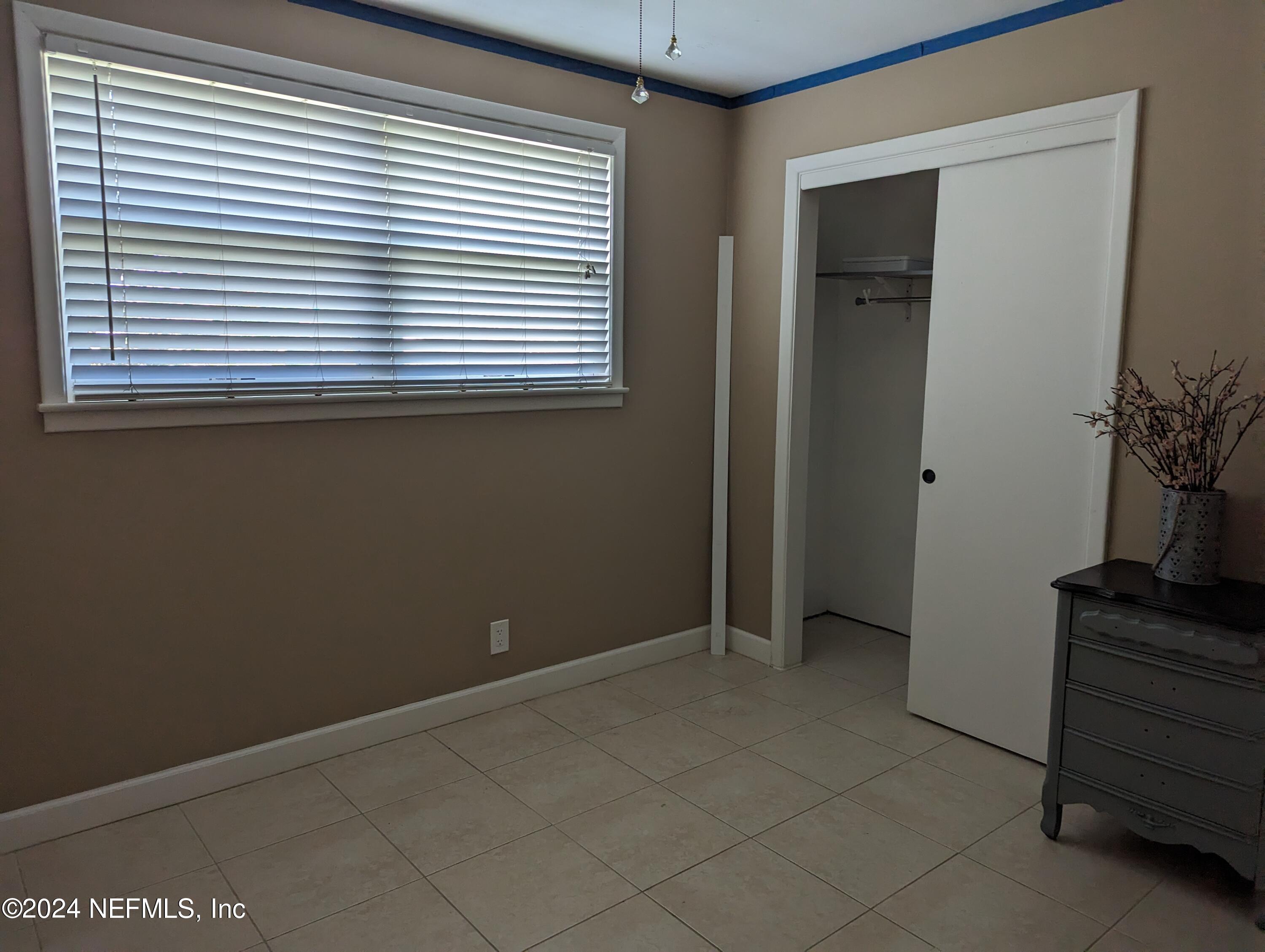 5120 Oakside Drive Jacksonville, FL 32244 - Photo 17 of 24 a view of an empty room with a window