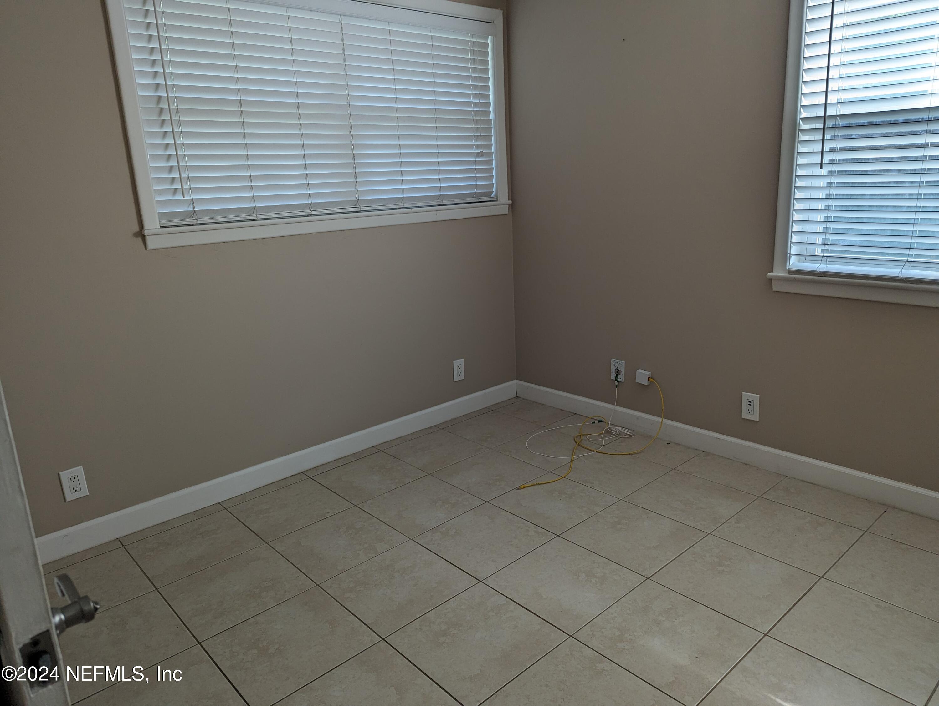 5120 Oakside Drive Jacksonville, FL 32244 - Photo 19 of 24 an empty room with a window
