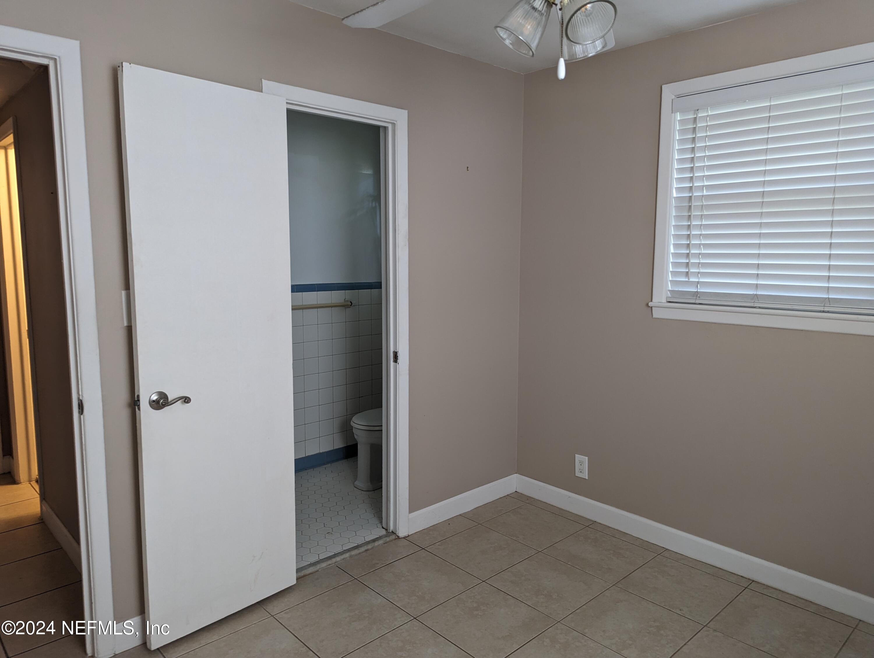 5120 Oakside Drive Jacksonville, FL 32244 - Photo 20 of 24 an empty room with windows and closet