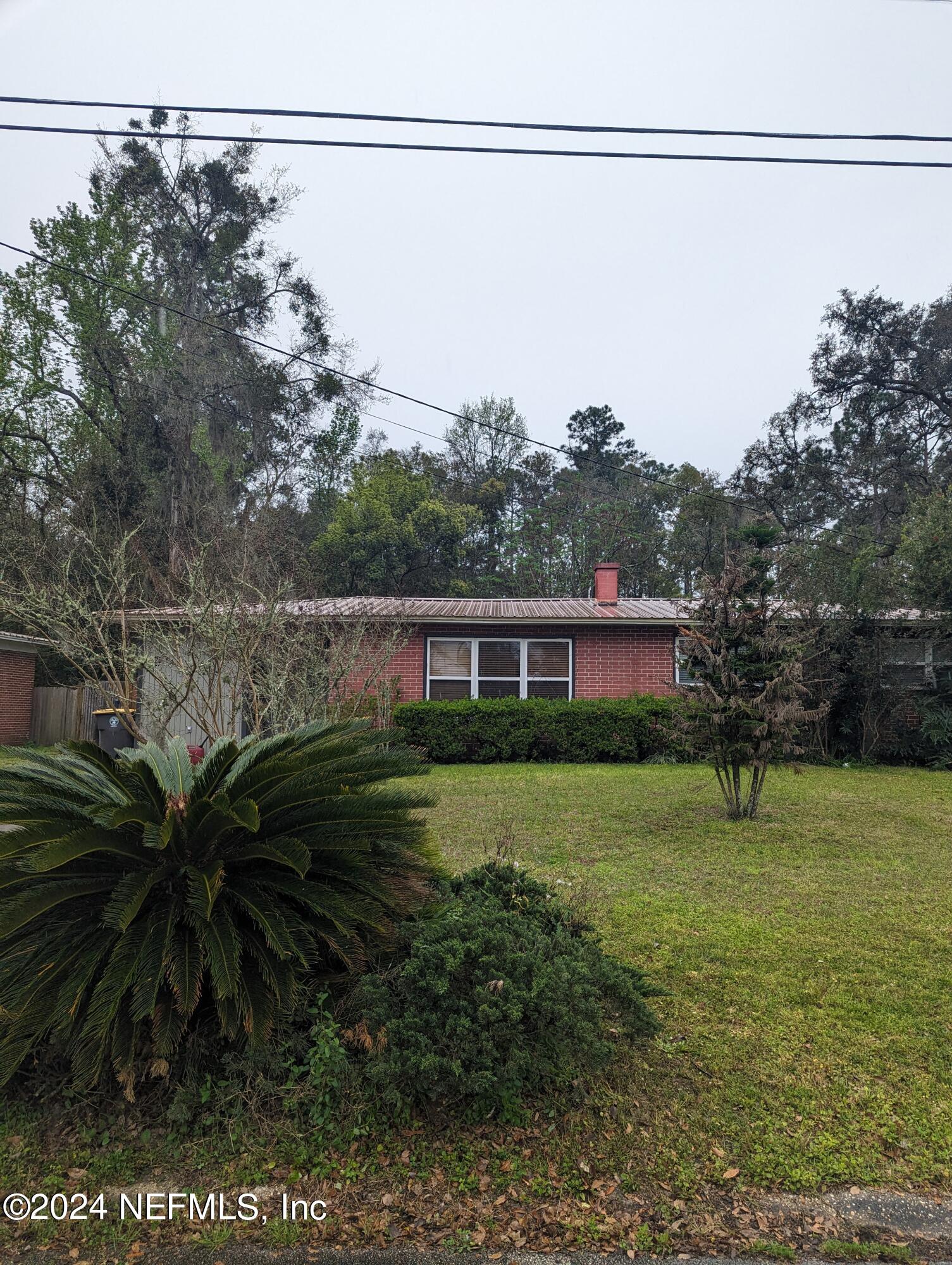 5120 Oakside Drive Jacksonville, FL 32244 - Photo 2 of 24 a view of a house with a yard