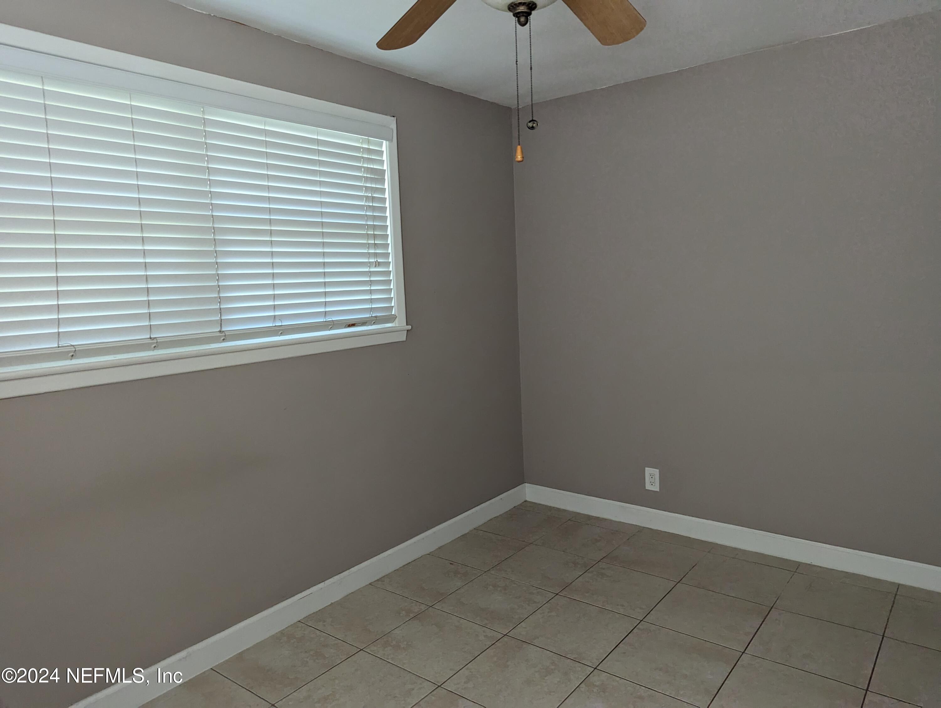 5120 Oakside Drive Jacksonville, FL 32244 - Photo 21 of 24 an empty room with a window